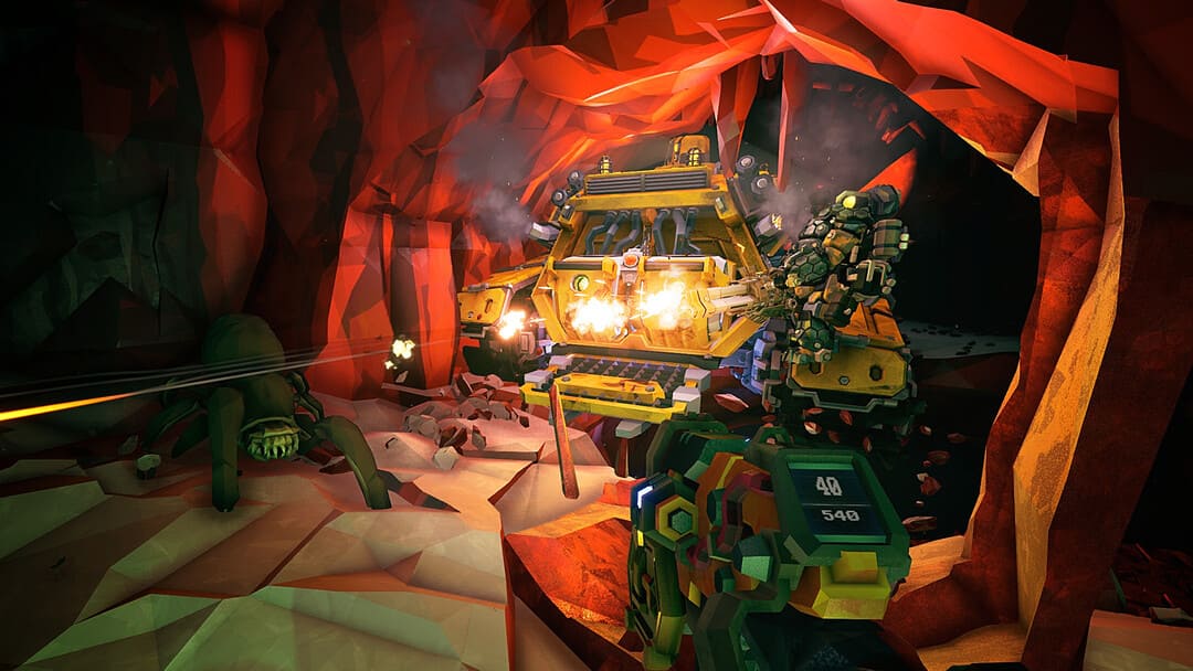 게임의 스크린 샷 Deep Rock Galactic은 반대편에 큰 거미가있는 바위를 뚫고있는 복셀 스타일 마이닝 머신을 보여주는 스크린 샷