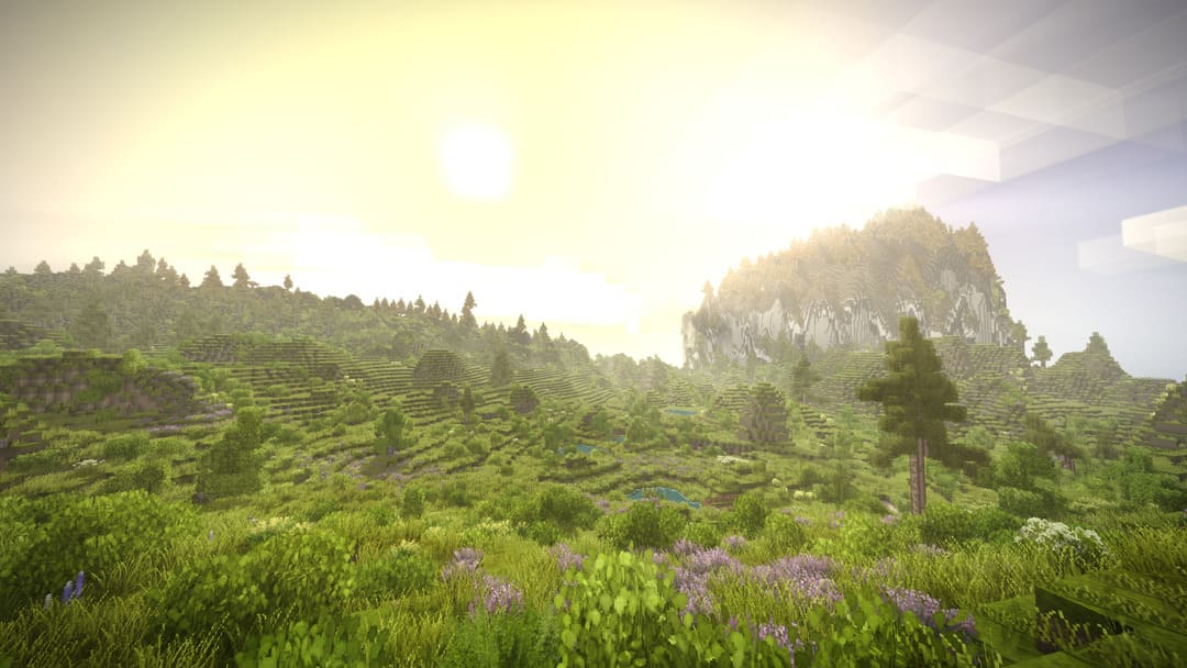 Blocky, Voxel Art, Rolling Hills at Sunrise를 보여주는 Game Vintage Story의 스크린 샷, 배경 안개에 작은 산이 있습니다.